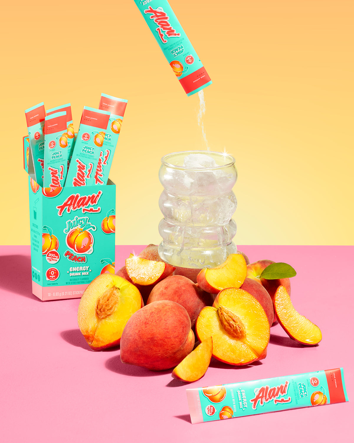 A display of Energy Sticks in Juicy Peach next to a pile of Peaches.